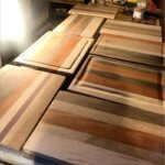 Murderingtowne Press and Company customers cutting boards. 